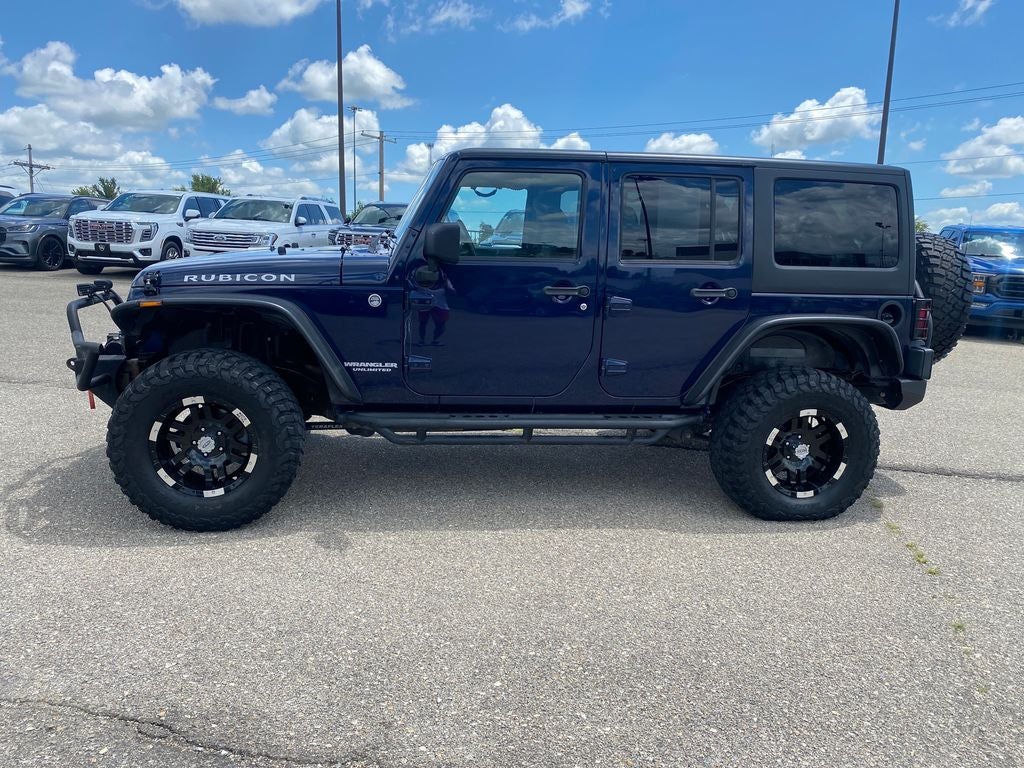 2013 Jeep Wrangler — rear three-quarter view