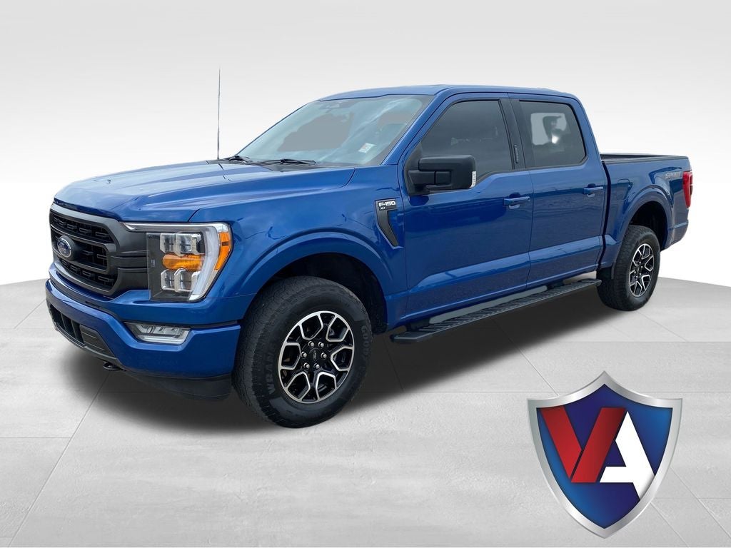 2023 Ford F-150 XLT in Blue Metallic — front three-quarter view